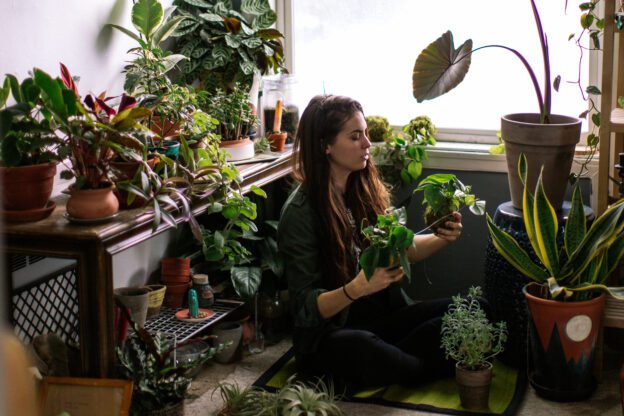 young woman gardening after learning how to heal from trauma